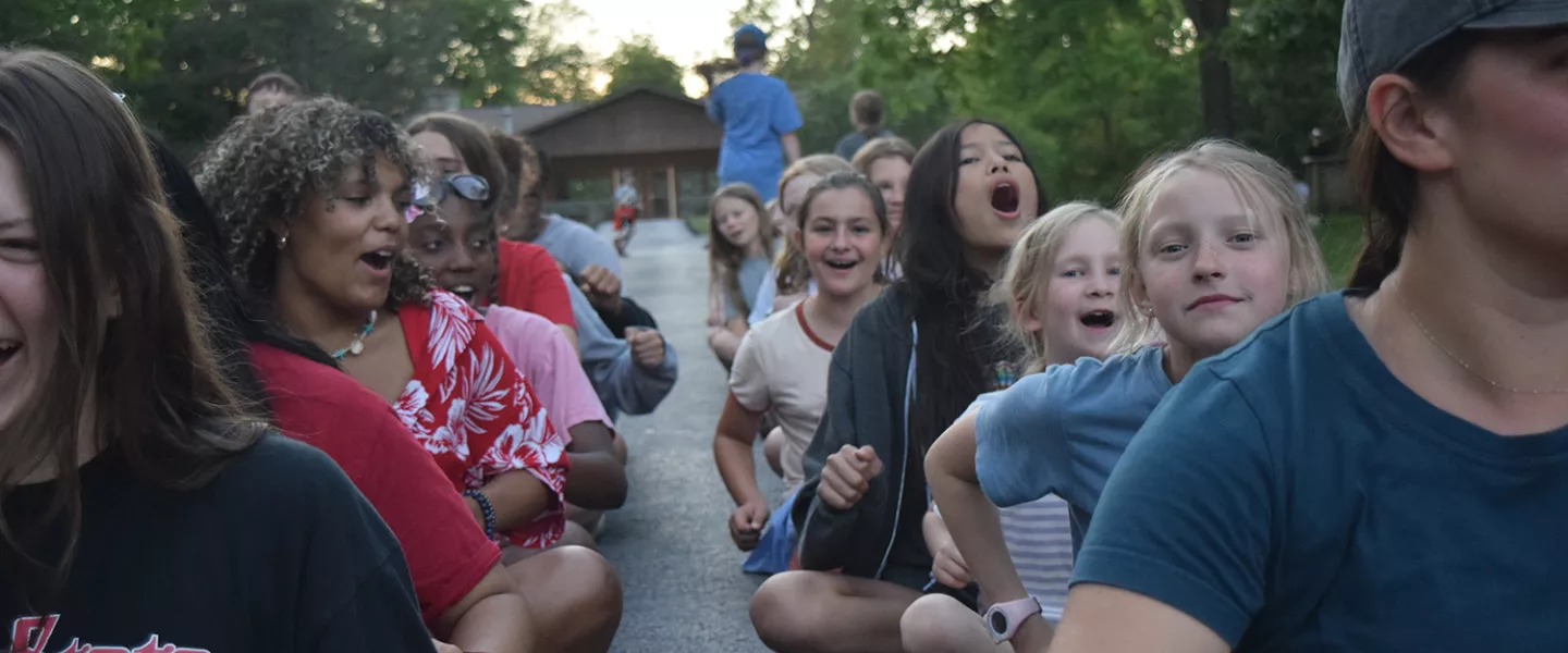 campers sitting outside at camp