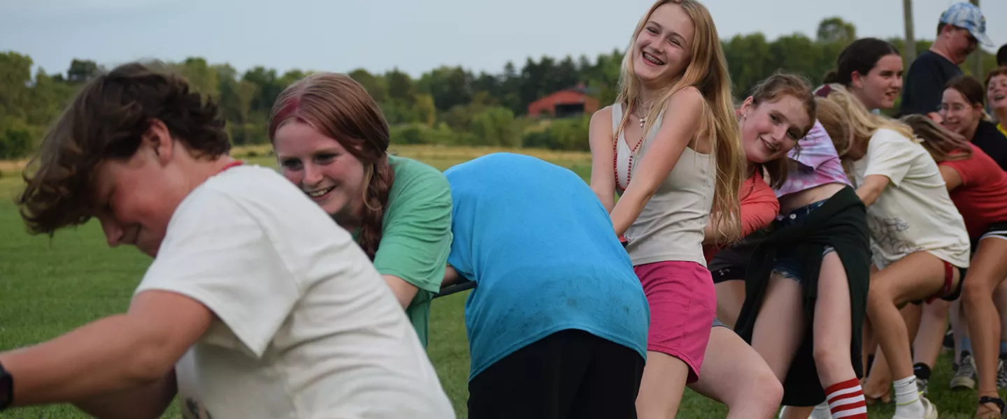 Campers playing tug of war