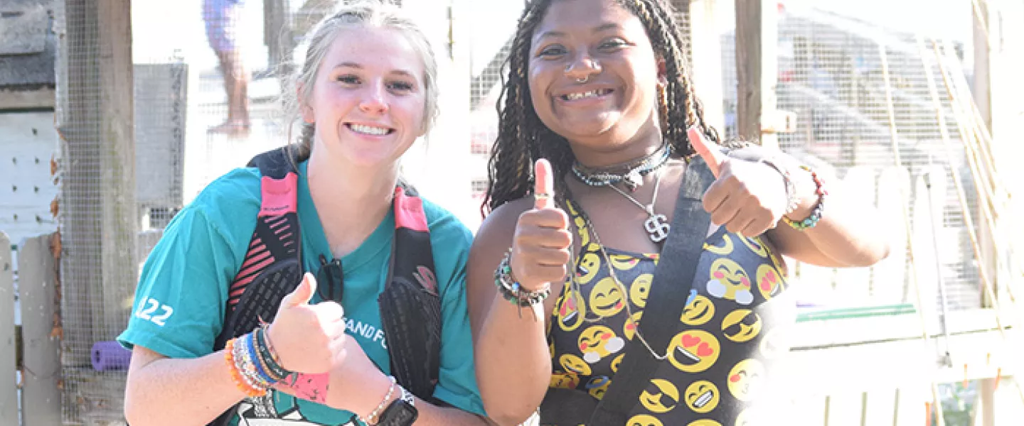 Camp staff giving thumbs up