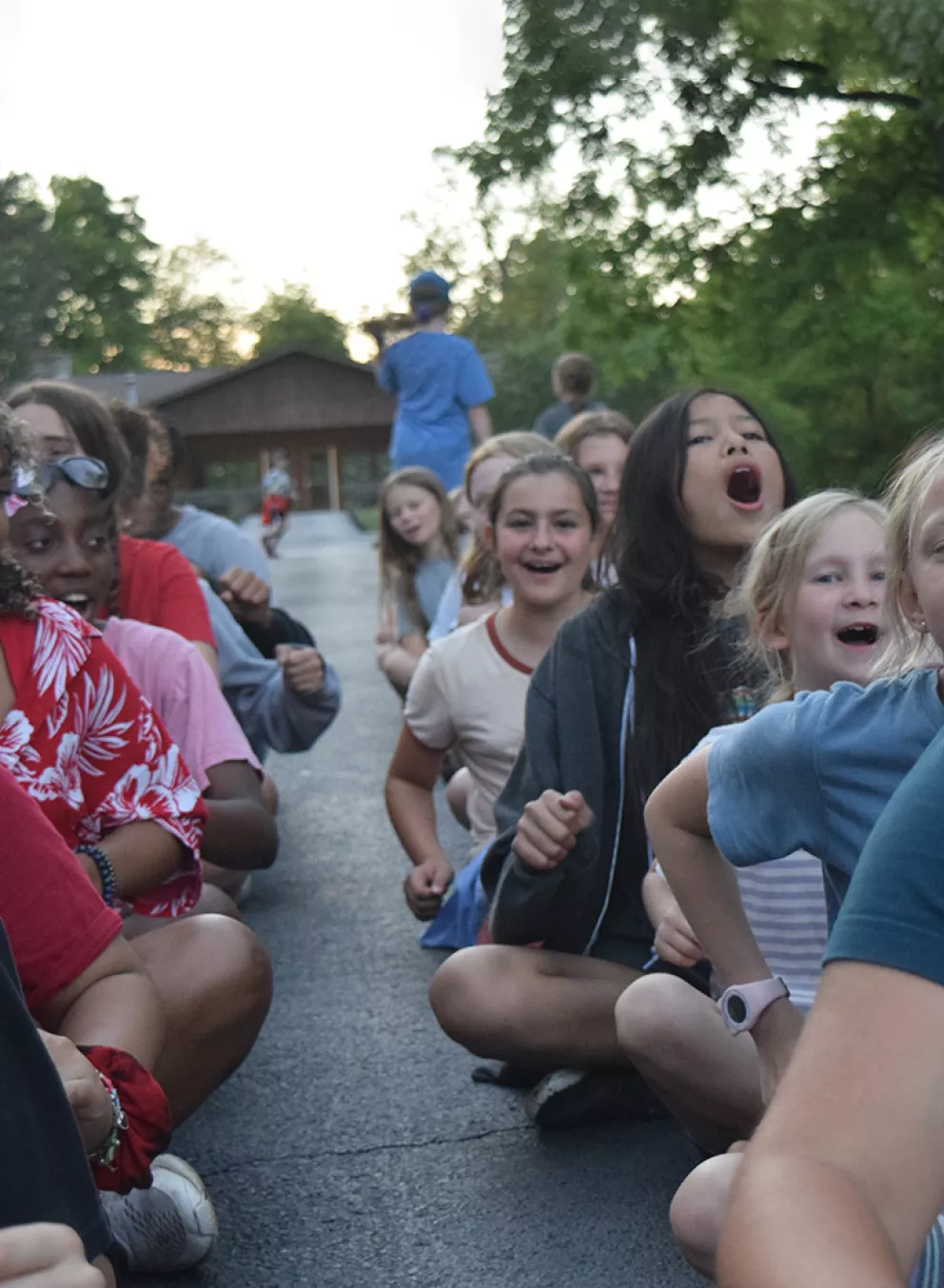 campers sitting outside at camp