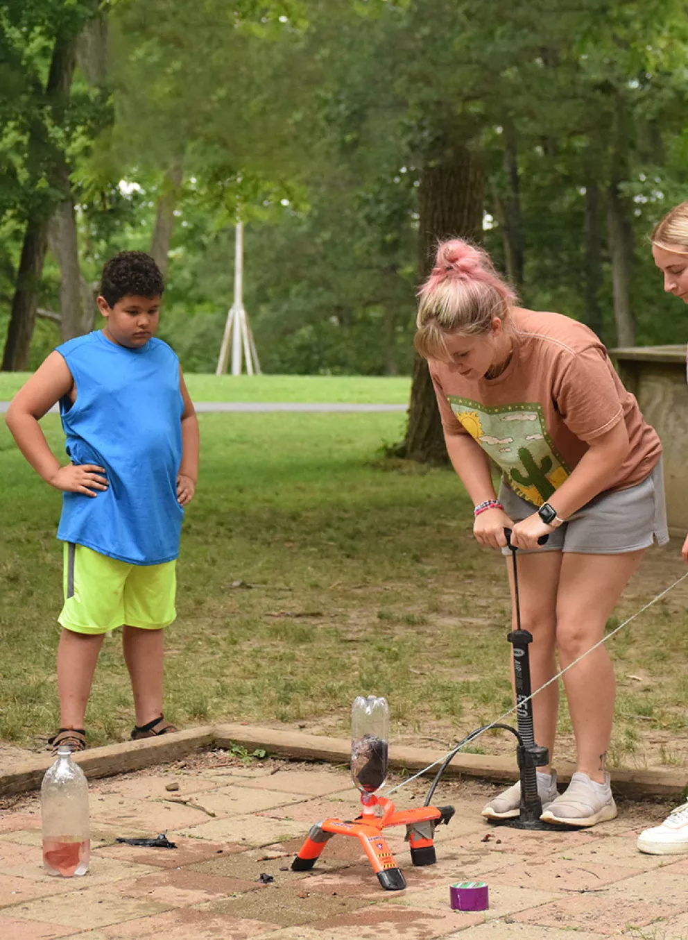 Campers and staff doing a science experiment