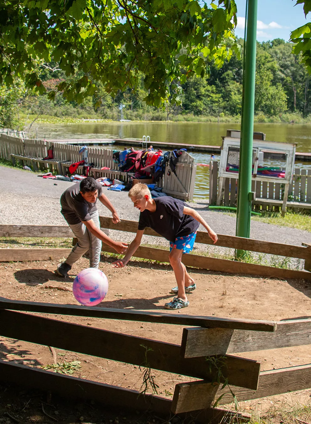 campers playing a game near the lake