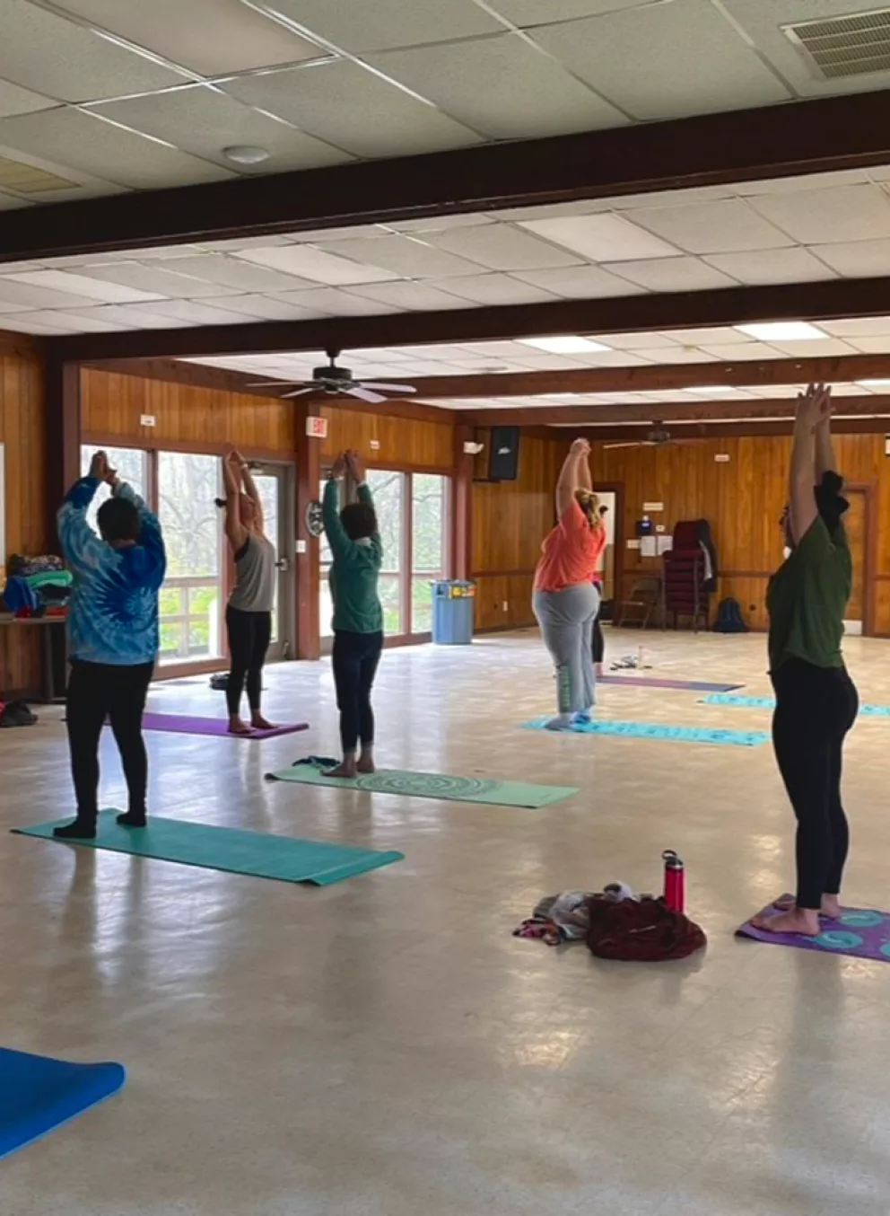 women's weekend campers doing indoor yoga