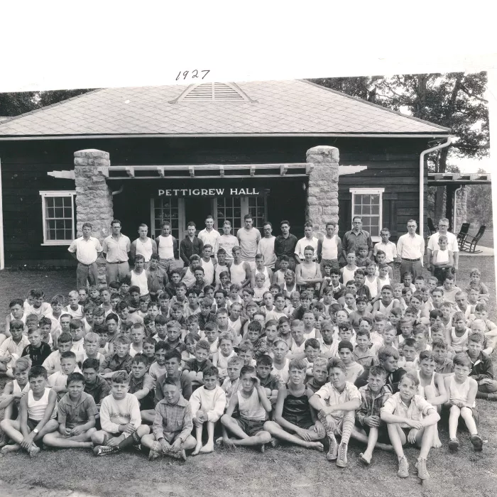 historical group of campers in front of Pettigrew Hall