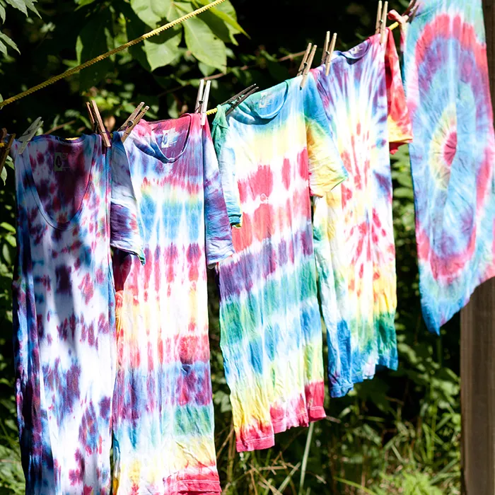 tie dye t-shirts hanging on a clothes line