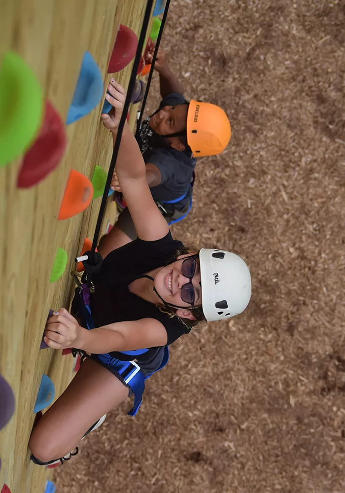 Campers on climbing wall