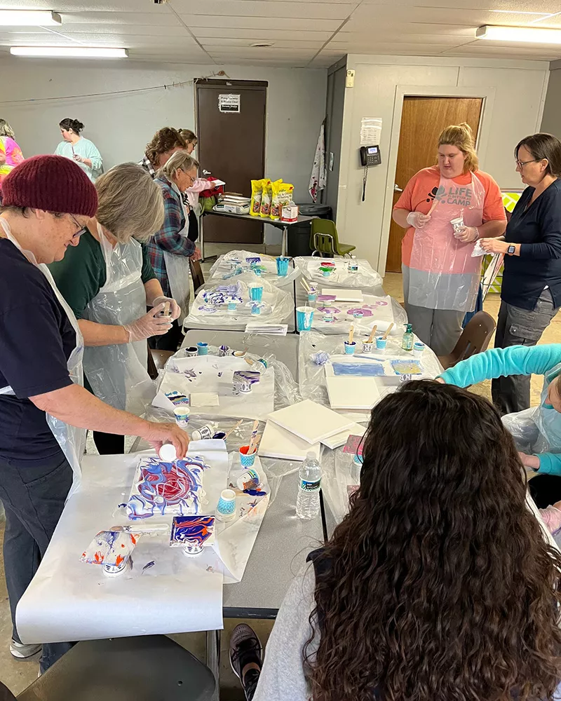 women's weekend campers doing a craft