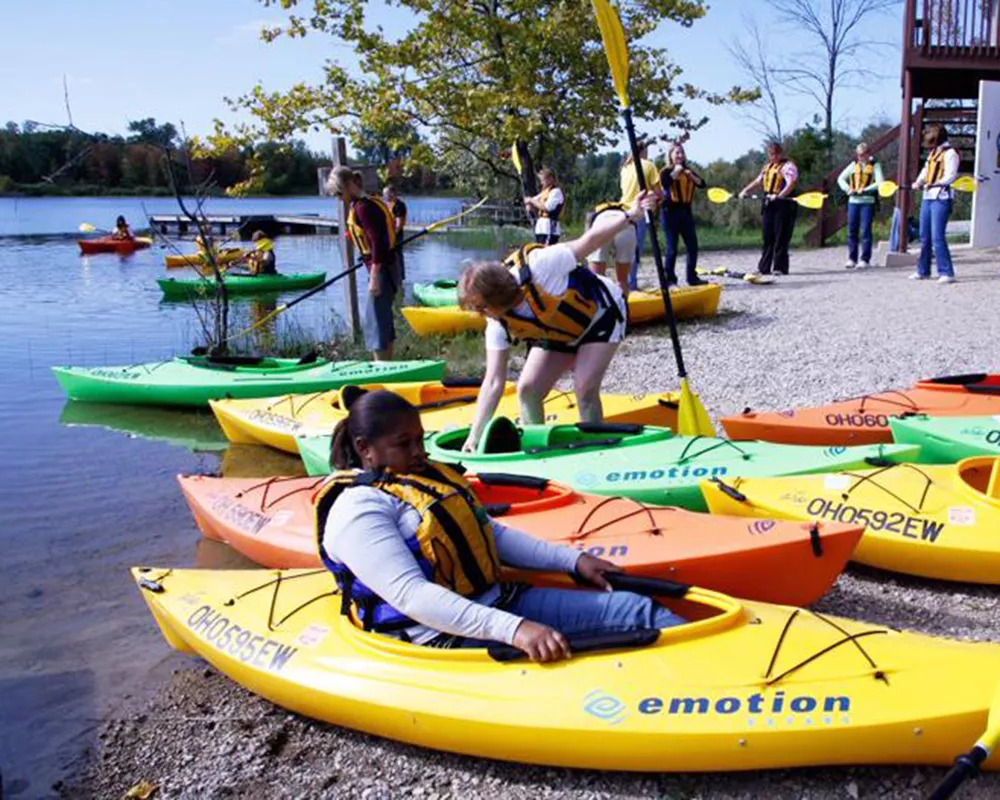 women's weekend campers getting ready to kayak