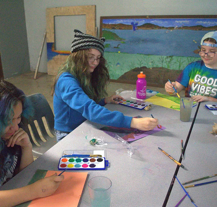 Campers painting an art project